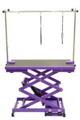 K9 Trailer Rentals The Electric Grooming Table N-109X is a purple, adjustable pet grooming table with a black tabletop, metal arm, and two hanging loops.