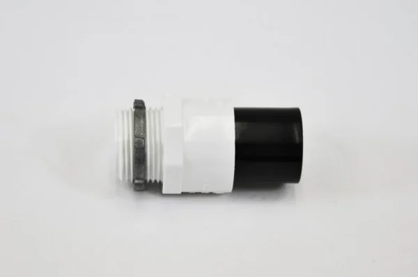 K9 Trailer Rentals A plastic threaded pipe connector with white and black sections, and a metal ring, shown on a plain white background.