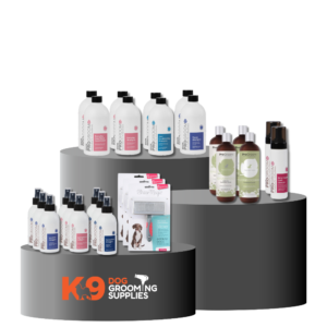 K9 Trailer Rentals A three-tiered black display showcases "Import placeholder for 989205" dog grooming products—shampoos, conditioners, sprays, and detanglers in bottles—with the "K9 Dog Grooming Supplies" logo on the front.